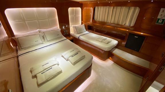 Comfortable cabin with double and single bed on yacht Gül Maria